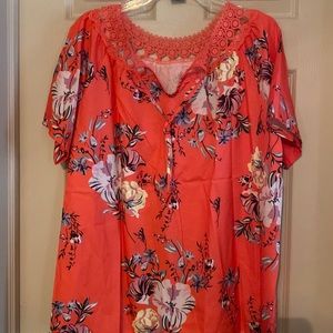 Orange top with lacey neckline  and tie in the front